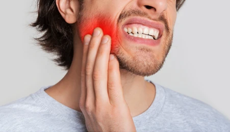 symptoms of jaw infection after root canal